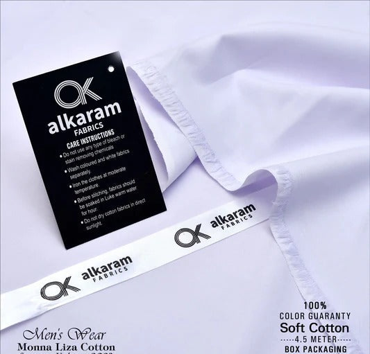 Alkaram Fabrics label on a white fabric with care instructions.